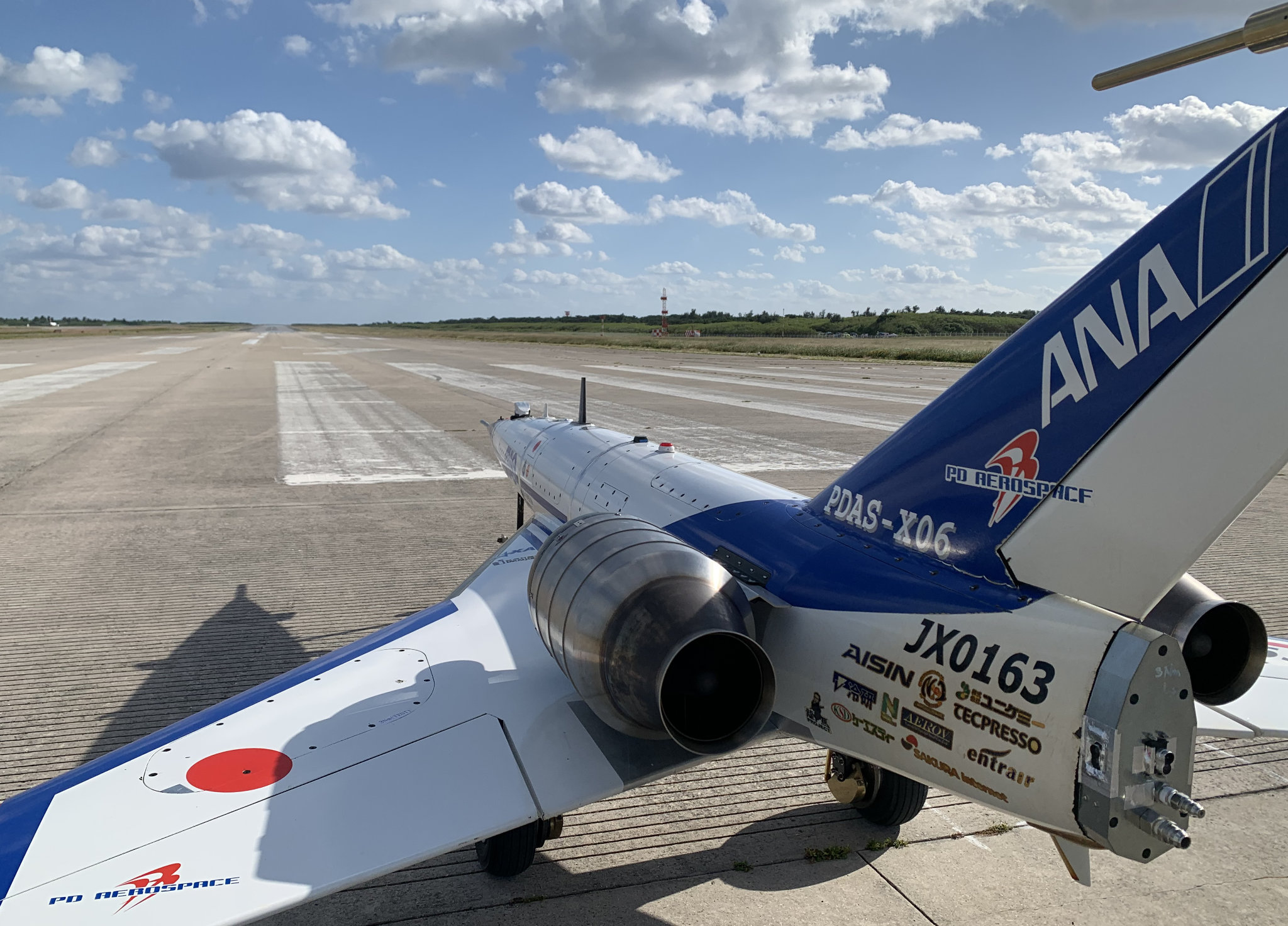 PD AeroSpace test aircraft on the runway at Shimojishima with the TECPRESSO logo on its fuselage